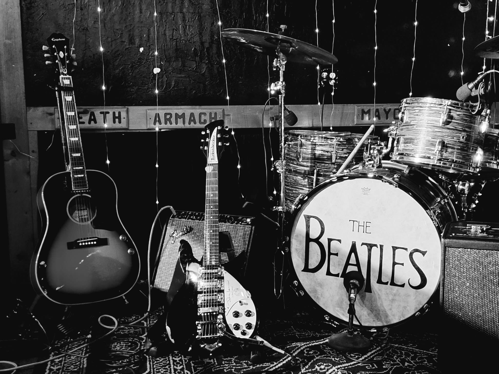Vintage drum kit and guitars set up for a Boots & Suits show